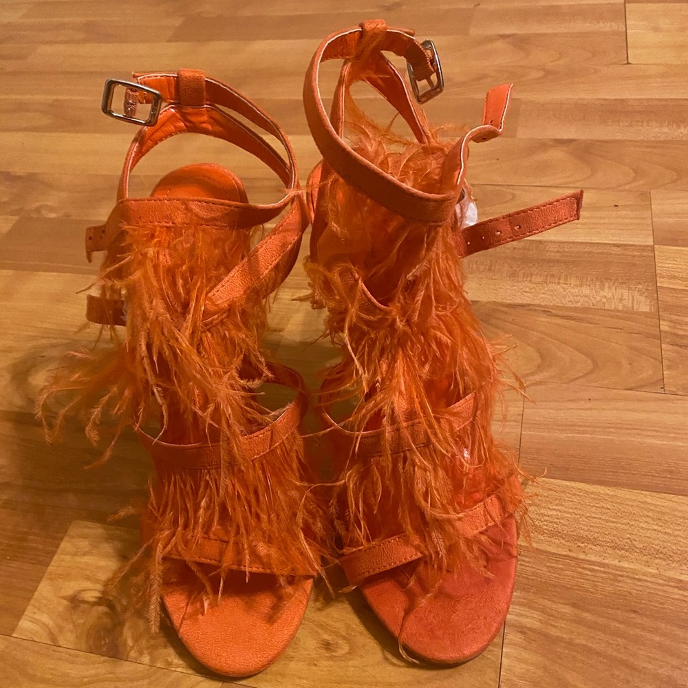 Orange heels with feathers
